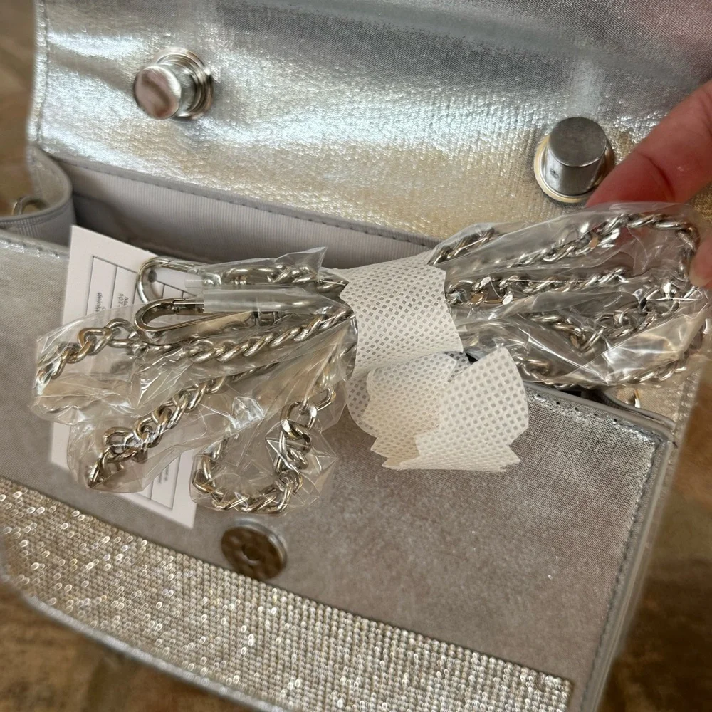 NWT Urban Expressions Silver Clutch/Purse with handle and matching chain straps.